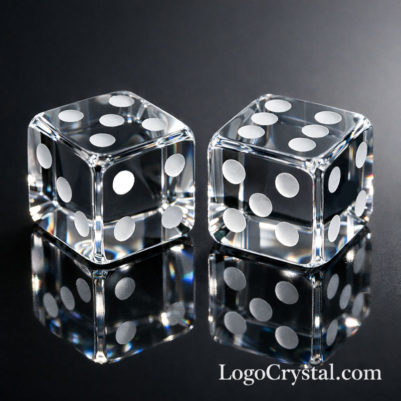 Luxury frosted crystal dice executive gift with custom internal 3D model on a dark wooden desk.