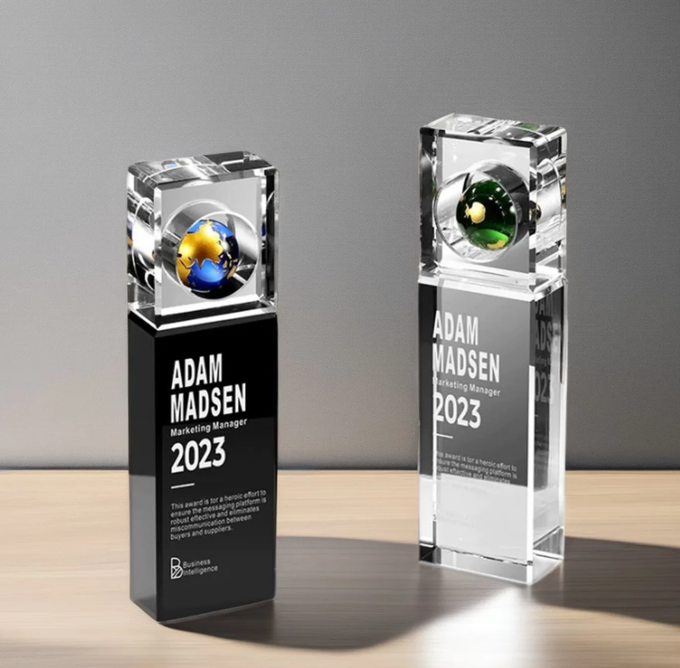 2026 custom black and clear crystal globe trophies with blue and green crystal earth tops, engraved black bases and clear crystal columns